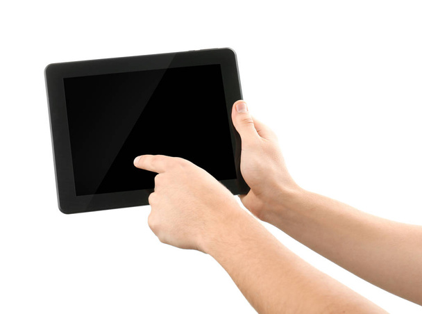 Νεαρός άνδρας που χρησιμοποιούν tablet Pc σε λευκό φόντο - Φωτογραφία, εικόνα
