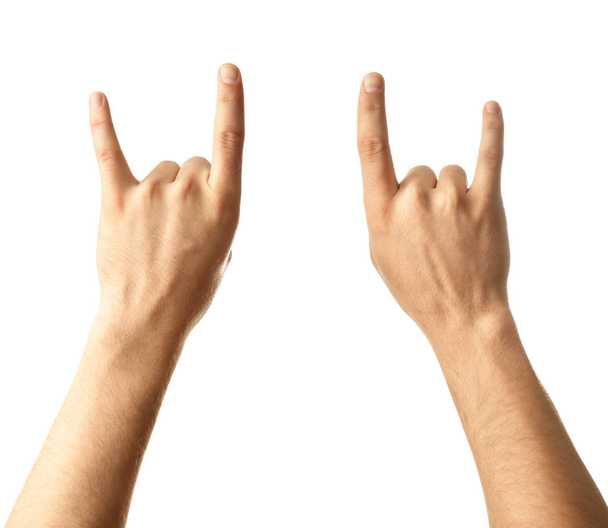 Мужские руки показывают жест "рога дьявола" на белом фоне
 - Фото, изображение