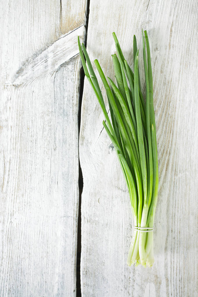 fresh onion on wooden surface - Photo, image