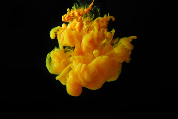 abstract dark background with orange splash of paint - Photo, Image