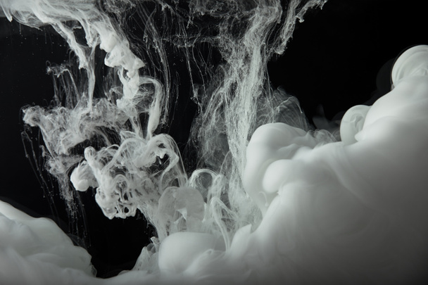 abstract monochrome flowing swirls of paint in water - Photo, Image