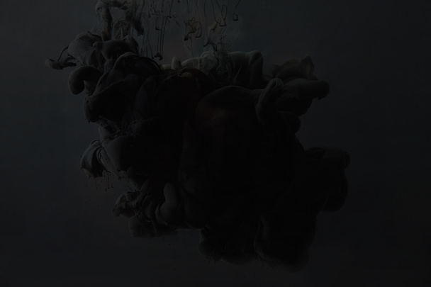 schwarze Acrylfarbe auf dunklem Hintergrund - Foto, Bild