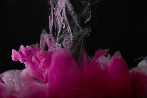 black background with pink splash of paint  - Foto, Imagem
