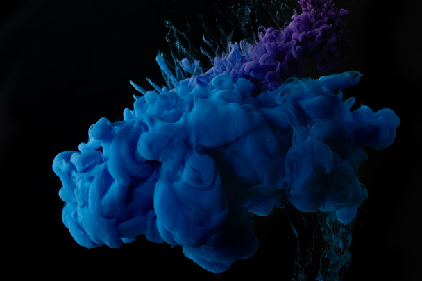 dark background with abstract blue swirls of paint - Φωτογραφία, εικόνα