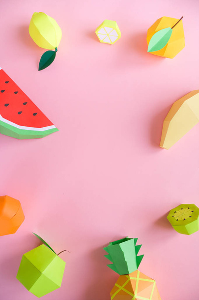 different exotic fruits made of paper on pink background - Foto, Imagen