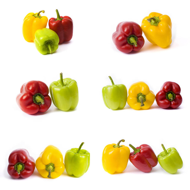 Sweet peppers on a white background. Red and yellow peppers on a white background. The colorful peppers in the composition. - Photo, image