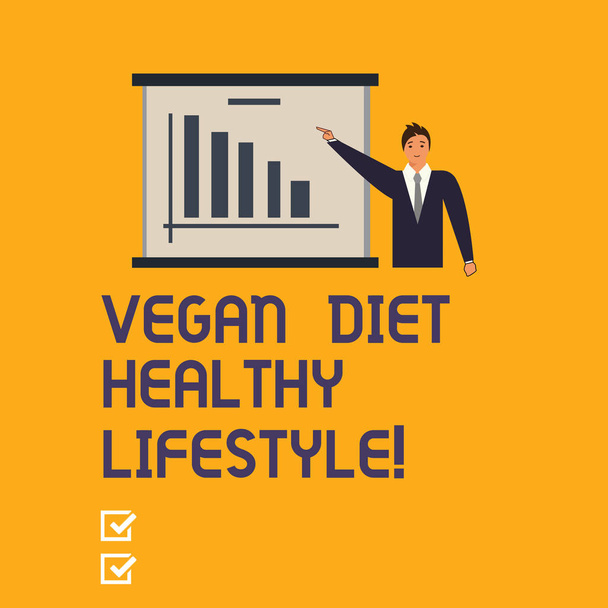 Σύνταξη σημείωσης δείχνει Vegan διατροφή υγιεινού τρόπου ζωής. Επαγγελματίες φωτογραφία προβάλλοντας υγιή τρόπο ζωής, τρώγοντας λαχανικά και φρούτα άνθρωπος στο Business κοστούμι δείχνοντας ένα χώρο αντίγραφο του σκάφους γράφημα ράβδων. - Φωτογραφία, εικόνα