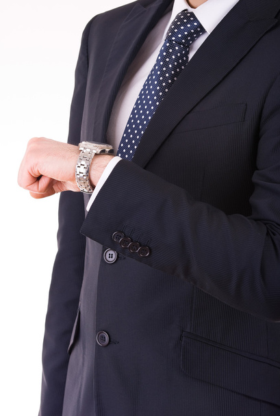 Businessman checking time on his wristwatch. - Valokuva, kuva