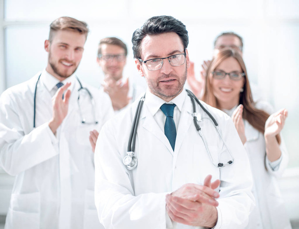 successful doctor, accepting congratulations from colleagues - Photo, Image