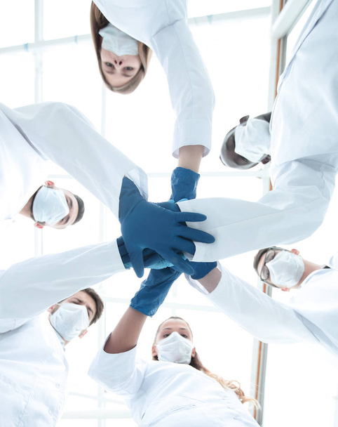 Doctors and nurses in a medical team stacking hands - Foto, afbeelding