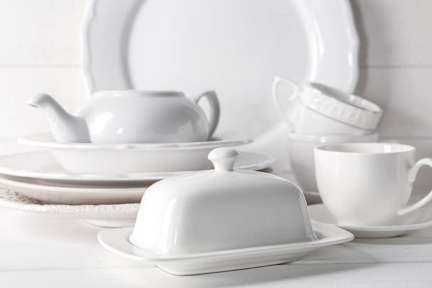 Set of clean dishware on white table - Photo, image