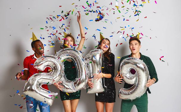 new Year party. company of cheerful friends with ballonss numbers 201 - Foto, imagen