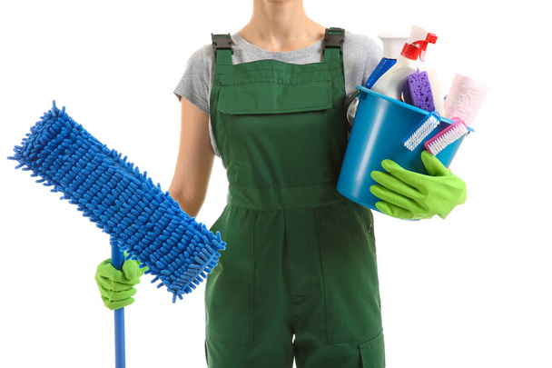Woman with cleaning supplies on white background - Foto, Bild