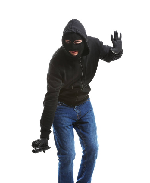 Male thief with gun on white background - Valokuva, kuva
