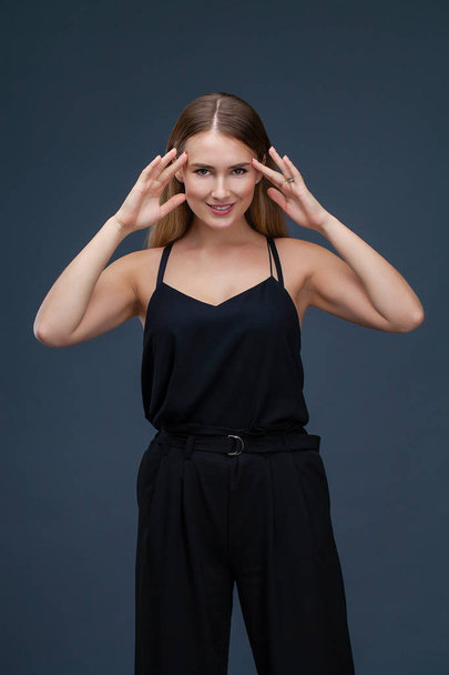 Happy Beautiful blonde woman in black dress, studio isolated on gray background - Foto, Imagem