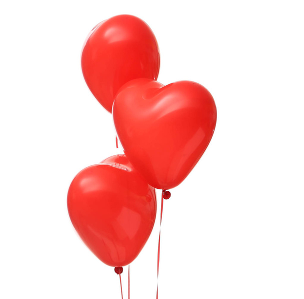Red heart-shaped air balloons for Valentine's day on white background - Photo, Image