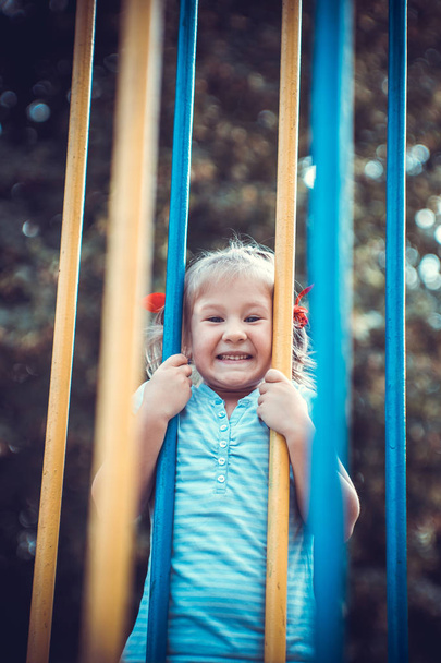 Cute little girl on the playground. - Foto, immagini