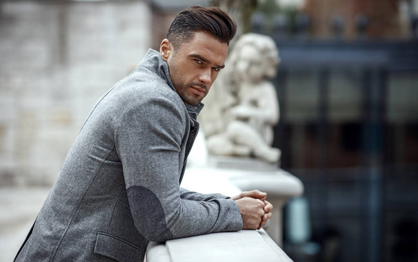 Portrait of handsome man in gray stylish jacket  - Photo, Image