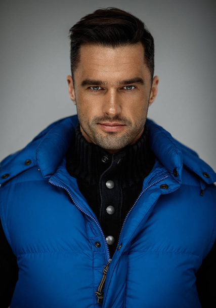 Portrait of handsome man wear blue west and turtleneck jumper - Foto, imagen