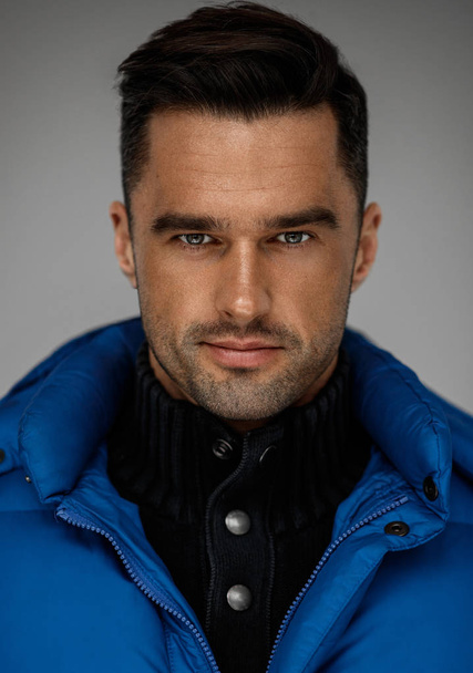 Portrait of handsome man wear blue west and turtleneck jumper - Foto, Bild