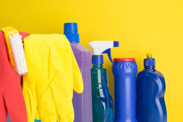 set of items for cleaning and rubber gloves, on a yellow background - Foto, Imagem