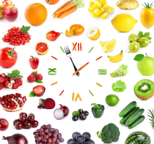 Food clock with fresh fruits and vegetables. Healthy food - Foto, imagen