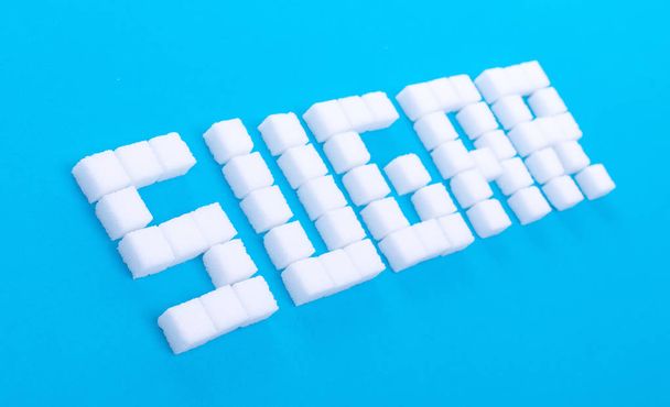 White sugar cubes background - Concept of unhealthy eating - Photo, Image