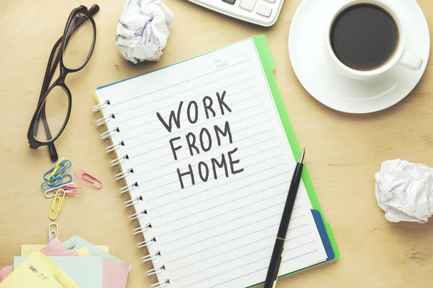 work from home text written on notepad and stationary on  yellow table - Φωτογραφία, εικόνα
