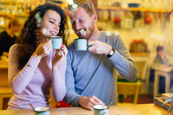 Romantic happy couple having date in coffee shop - Fotó, kép