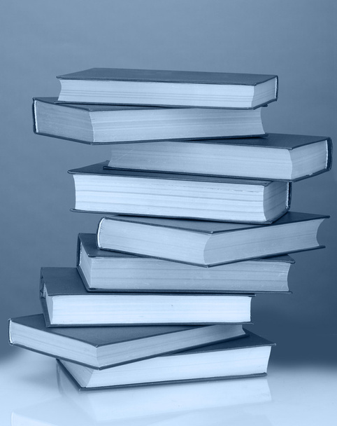 Stack of books in dark blue light - Foto, Imagem