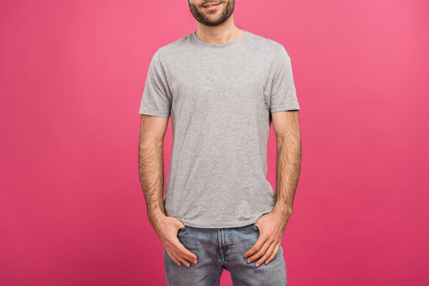 cropped view of man posing with hands in pockets, isolated on pink - Φωτογραφία, εικόνα