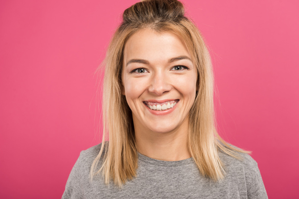 cheerful attractive woman in casual clothing, isolated on pink - Fotografie, Obrázek