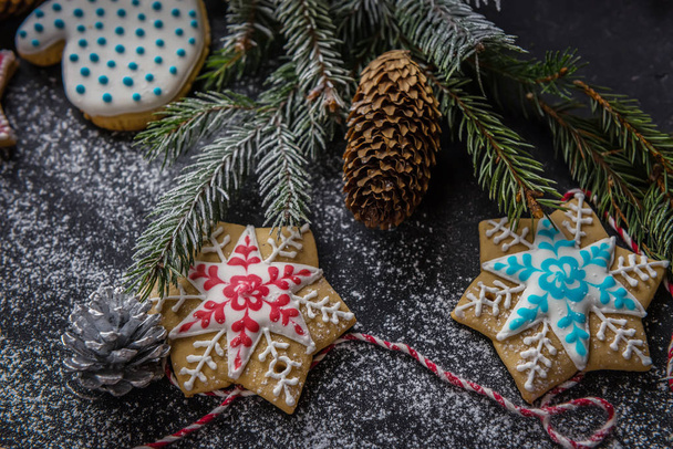 Christmas card, splash screen. Christmas tree and gingerbread on a light background. New year celebration and christmas conceptFlat lay with bright christmas decoration. New year celebration and christmas concept - Φωτογραφία, εικόνα
