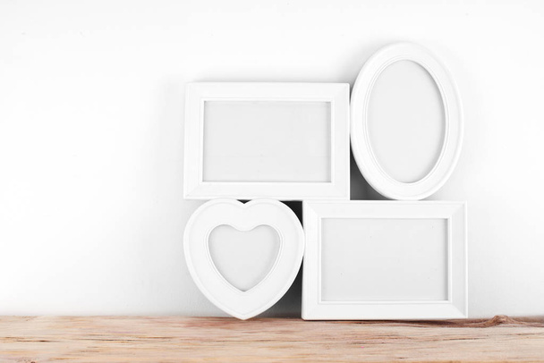 empty, heart shaped photo frame on white background - Fotó, kép
