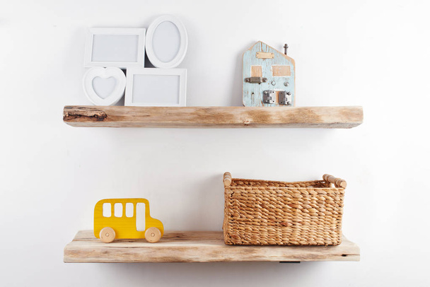 Wooden shelves with decor items. Home interior - Fotó, kép