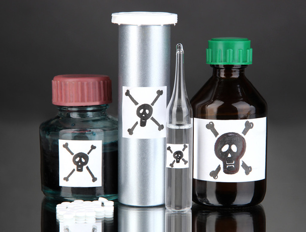 Deadly poison in bottles on black background - Φωτογραφία, εικόνα
