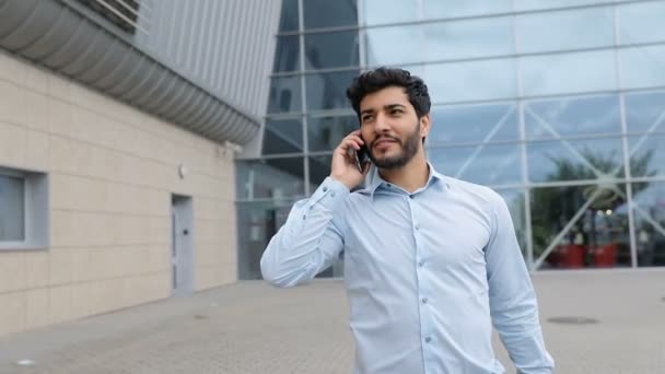 Handsome Man Talking On Phone Near Office Outdoors - Πλάνα, βίντεο