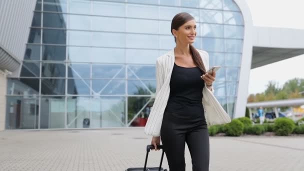 Business Trip. Beautiful Woman With Phone And Suitcase - Video