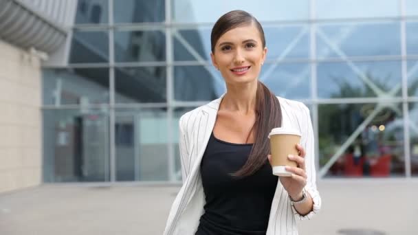 Business Woman With Coffee And Suitcase Walking Near Airport - Video
