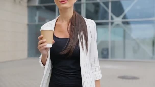 Business Woman With Coffee And Suitcase Walking Near Airport - Materiaali, video