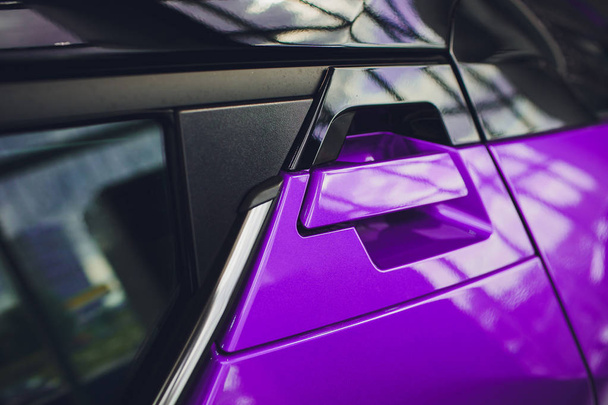 abstract photo car door handle purple and lock - Foto, afbeelding