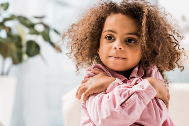 beautiful african american child embracing and looking away - Photo, Image