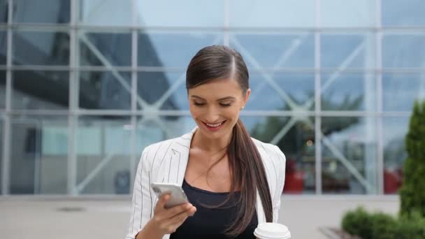 Business Woman With Phone And Coffee Going To Work - Video