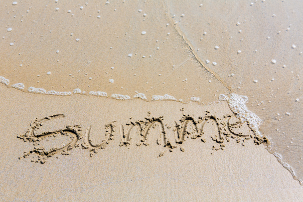 Summer handwritten inscription in sand on a beach - Foto, Imagem