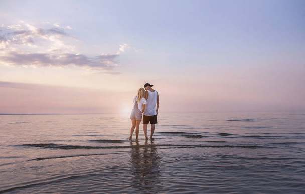 young beautiful couple in love admire the sea view - Foto, Imagem