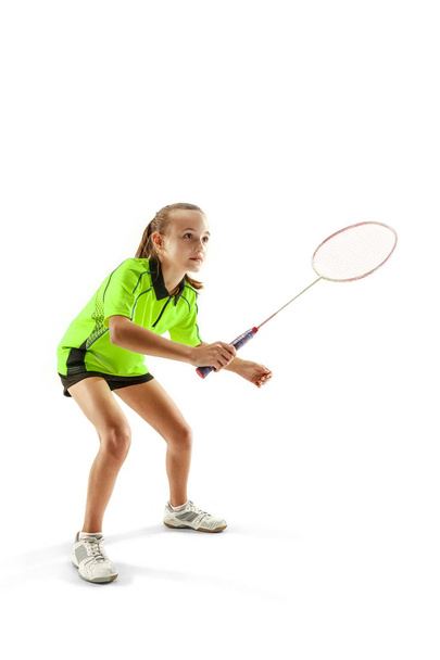 one caucasian young teenager girl woman playing Badminton player isolated on white background - Foto, Imagen