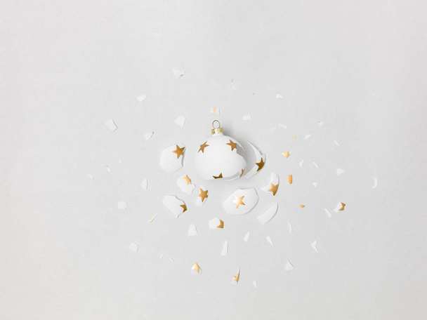 great exploding white bauble with golden stars on grey  background  - Zdjęcie, obraz