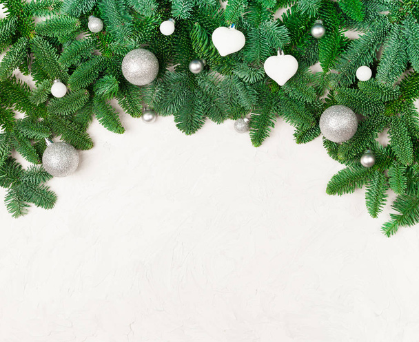 Christmas or New Year background - fir tree branches, glass toys with copy space. - Foto, afbeelding