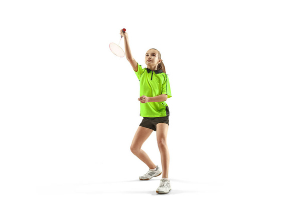 one caucasian young teenager girl woman playing Badminton player isolated on white background - Фото, изображение