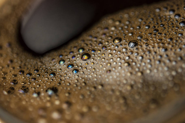 Koffie schuim extreme close-up. Macro textuur en achtergrond - Foto, afbeelding